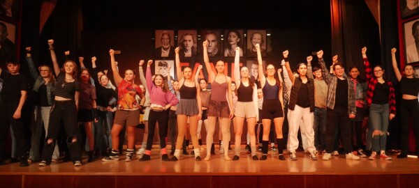 Group on stage performing in Fame 