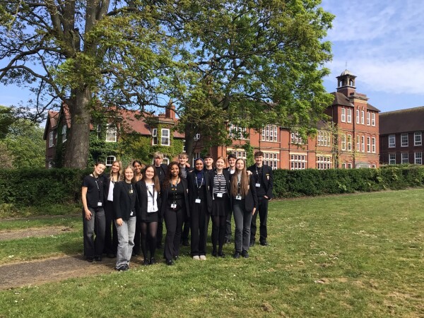Group of students standing outside the school 